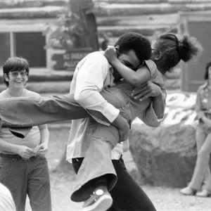 Muhammad Ali Hugging a Little Girl, 27th August 1974 Print
