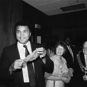 Muhammad Ali (left) shows off a conjuring trick when visiting Birmingham Muhammad Ali (left) shows off a conjuring trick when visiting Birmingham
