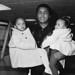 Muhammad Ali with daughters at Heathrow Airport Print 1978