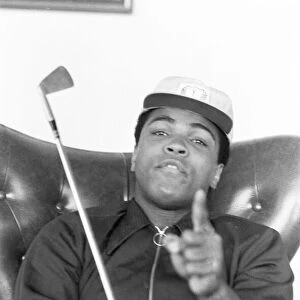 Muhammad Ali pictured having a round of tea-cup golf at his hotel near Dublin Ireland