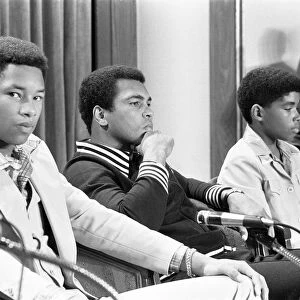 Muhammad Ali at a press conference with Phillip "Chip"McAllister, left