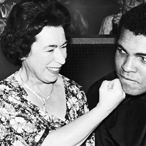 Muhammad Ali with Queen lookalike Jeanette Charles at Boxer John Contehs new night club