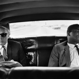 Muhammad Ali (right) with Daily Mirror reporter Donald Zec in the back of a car Muhammad Ali (right) with Daily Mirror reporter Donald Zec in the back of a car