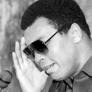 Muhammad Ali seen here at the post fight press conference following his lost to Larry