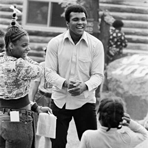 Muhammad Ali shares a joke with fans at his training camp in Pennsylvania