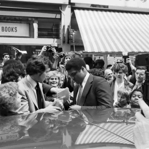 Muhammad Ali signing autographs outside the Odeon in Birmingham. 7th June 1979