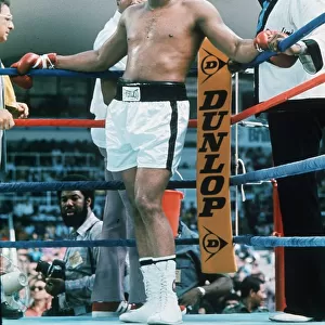 Muhammad Ali stands in the corner of the ring during the heavyweight world title fight