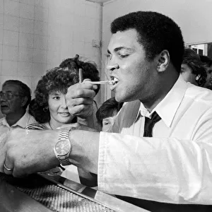 Muhammad Ali visits retired boxer Jack Bodell at his Fish and Chip Shop in Coventry
