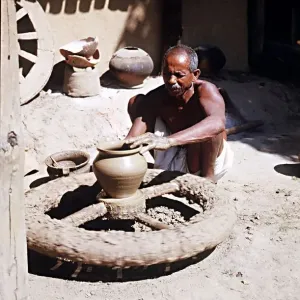 Muria tribal (Gonds) forming clay pot at Narainpur Bastar District MP India