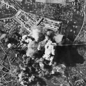 Murky smoke spouts up from the Bettenhausen Focke Wulf plant at Kassel as bombs register