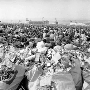 Music fans surrounded by empty cans at The Isle of Wight Festival. 30th August 1970