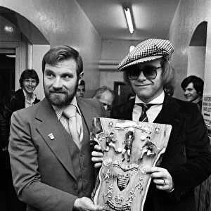 Musician and Watford FC chairman Elton John is presented with a special Jubilee plaque