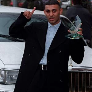 Naseem Hamed Boxing October 98 WBO Featherweight champion standing next to white
