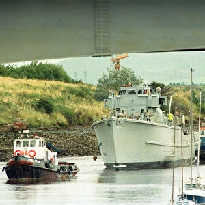 Former Navy Minehunter HMS Kellington being towed underneath the Princess of Wales Bridge