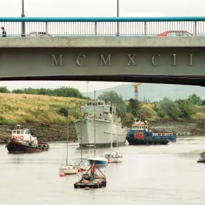 Former Navy Minehunter HMS Kellington being towed underneath the Princess of Wales Bridge Former Navy Minehunter HMS Kellington being towed underneath the Princess of Wales Bridge