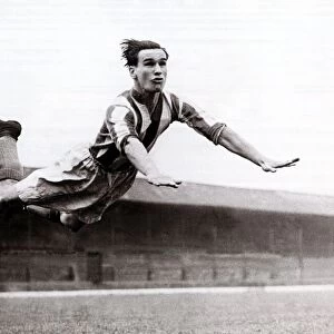 Neil Franklin, Stoke City football player, circa 1947 In mid flight at