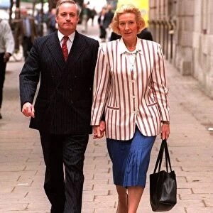 Neil Hamilton former MP for Tatton with his wife Christine near Millbank Westminster