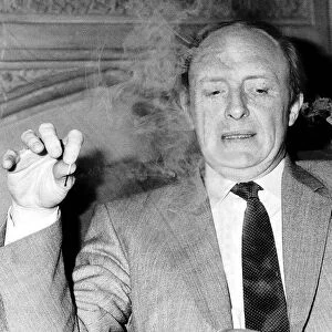 Neil Kinnock ex-MP and Leader of the Labour Party smoking a pipe at the House of Commons