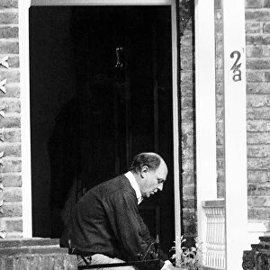 Neil Kinnock MP Former Labour Party Leader outside his house taking in his delivered milk