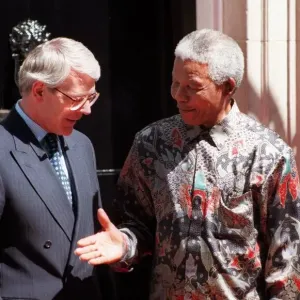 Nelson Mandela on the doorstep of 10 Downing Street with Prime Minister John Major