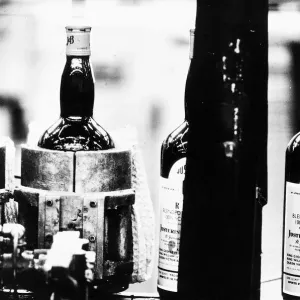 New bottles of whisky on the production line at a Whisky bottling plant 1971