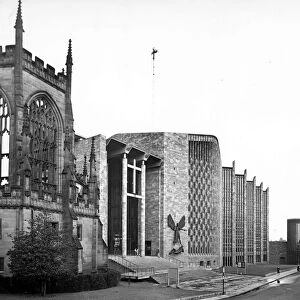 The new Coventry cathedral stands directly next to the ruins of the former one which was