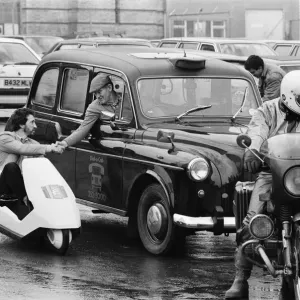 The New Electric Vehicle Picture shows a gentleman in London driving