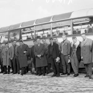 New England manager Alf Ramsey stands in front of the team bus with his squad of players New England manager Alf Ramsey stands in front of the team bus with his squad of players