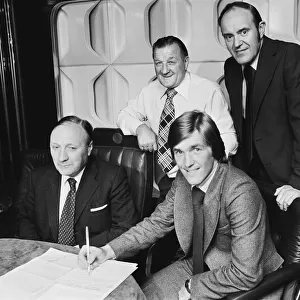 New Liverpool signing Kenny Dalglish with manager Bob Paisley at Anfield as he completes