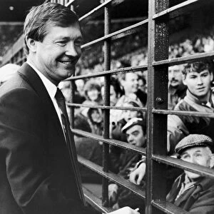 New Manchester United manager Alex Ferguson waves to the Old Trafford crowd before