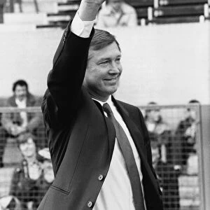 New Manchester United manager Alex Ferguson waves to the crowd before his first match in