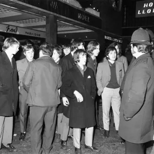 New Year revellers chat with the police outside the Hotel Leofric. 31st December 1971