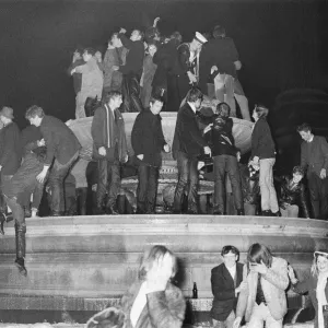 New Years Day 1967. Young people celebrate in the fountains at Trafalgar Square, London New Years Day 1967. Young people celebrate in the fountains at Trafalgar Square, London