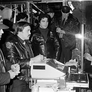 New York Police question a man in a shop. 13th February 1981
