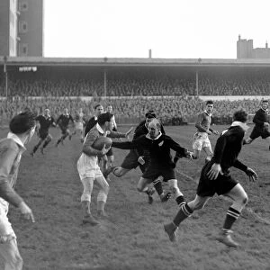 New Zealand full back Bob Scott attempts to tackle the Welsh attack at Cardiff Arms Park