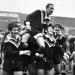 New Zealand players carry off their captain Roy Christian after beating Great Britain in