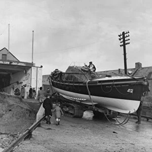 The Newbiggin lifeboat Richard Ashley being towed back into the Lifeboat House after