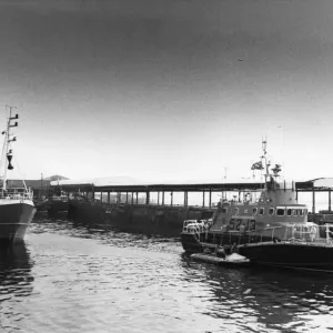 Newcastle lifeboat at the dock. On the right is the George Newcastle lifeboat at the dock. On the right is the George