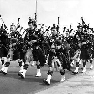 The Newcastle Pipe Band march along the seafront during a contest organised by North-East
