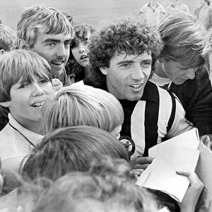 Newcastle United footballer Kevin Keegan is surrounded by young Newcastle fans during a