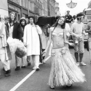 Newcastles Rag Queen, Christine Bateson, aged 18, wears a grass skirt to lead a