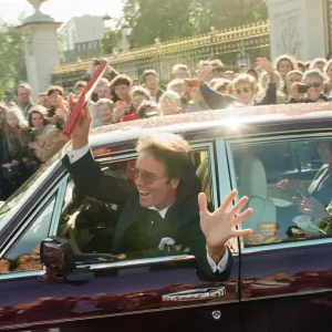 A newly-knighted Sir Cliff Richard leaves Buckingham Palace waving his gong aloft A newly-knighted Sir Cliff Richard leaves Buckingham Palace waving his gong aloft
