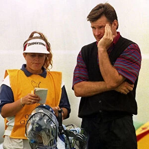 Nick Faldo ponders during The British Open with his caddie Fanny Sunnesson