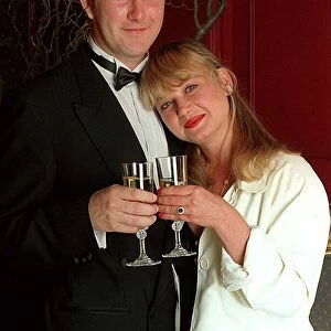 Nicola Duffett Actress with fiance Ian Henderson drinking champagne