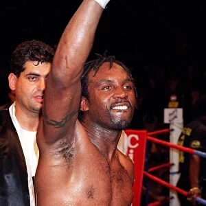 Nigel Benn celebraters his victory over Vincenzo Nariello in defence of his WBC super