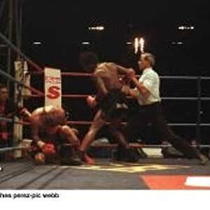 Nigel Benn finishes Danny Perez during their fight at Wembley