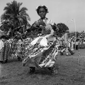 A Nigerian dancer from the Efik tribe stops at the end of a traditional dance for A Nigerian dancer from the Efik tribe stops at the end of a traditional dance for