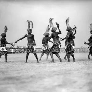 Print of Nigerian women in traditional costumes and feathered headdresses Print of Nigerian women in traditional costumes and feathered headdresses