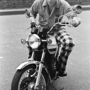 Nineteen year old dart player Eric Bristow poses in London sitting on a motorbike Nineteen year old dart player Eric Bristow poses in London sitting on a motorbike