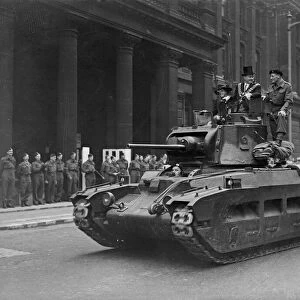 Norman Tiptaft Lord Mayor of Birmingham rides a Matilda tank at the head of a parade